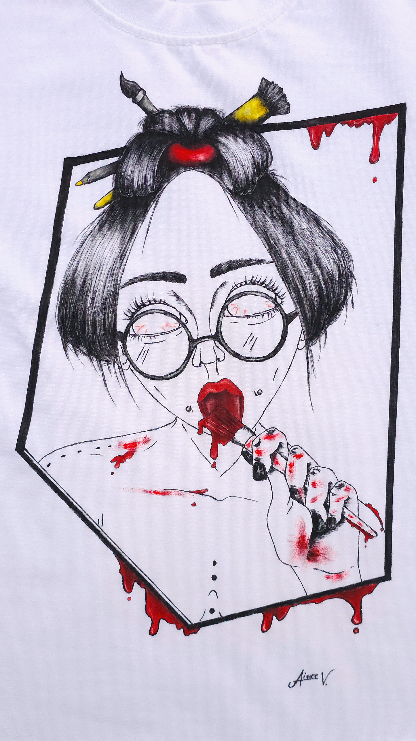 White t-shirt with a graphic design. The design is hand painted and shows a girl with round glasses, red paint dripping and a brush.