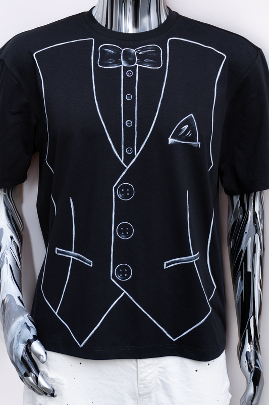 Close up of a Black t-shirt with white outline of a tuxedo with bow on a male mannequin.