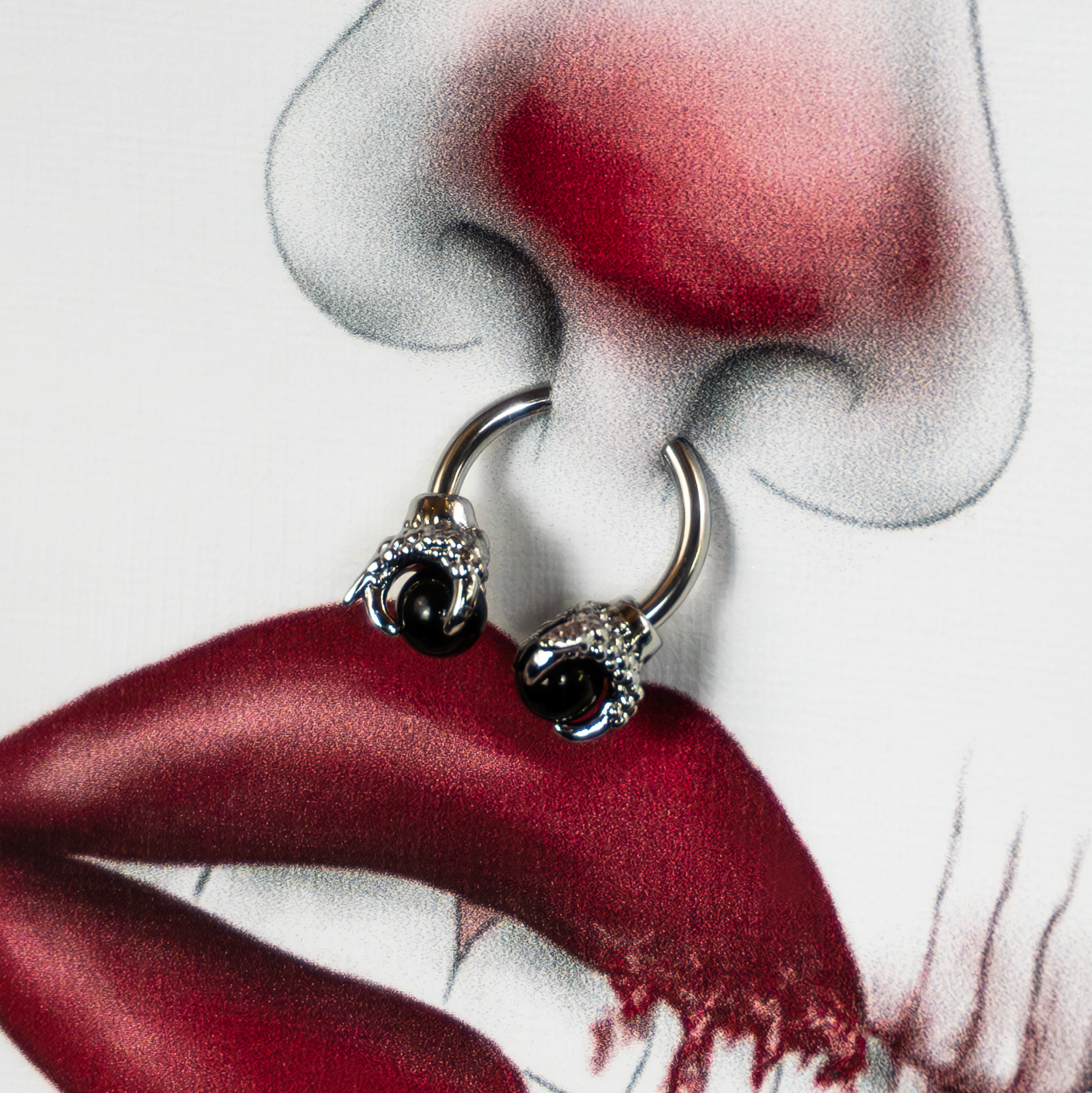 Men's pierced edition is showcasing a unique real piercing detail blended with hand drawn designs