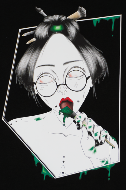 Close-up of Painted in Green design on black T-shirt showing expressive green brushstrokes and line work