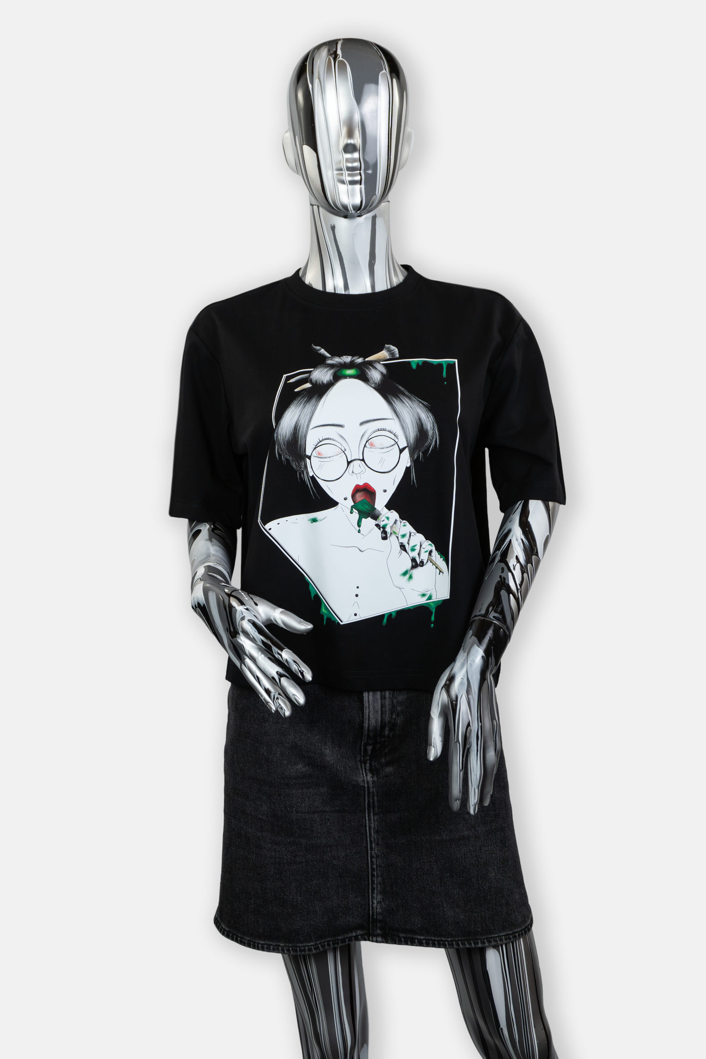 Female mannequin wearing Painted in Green statement tee in black