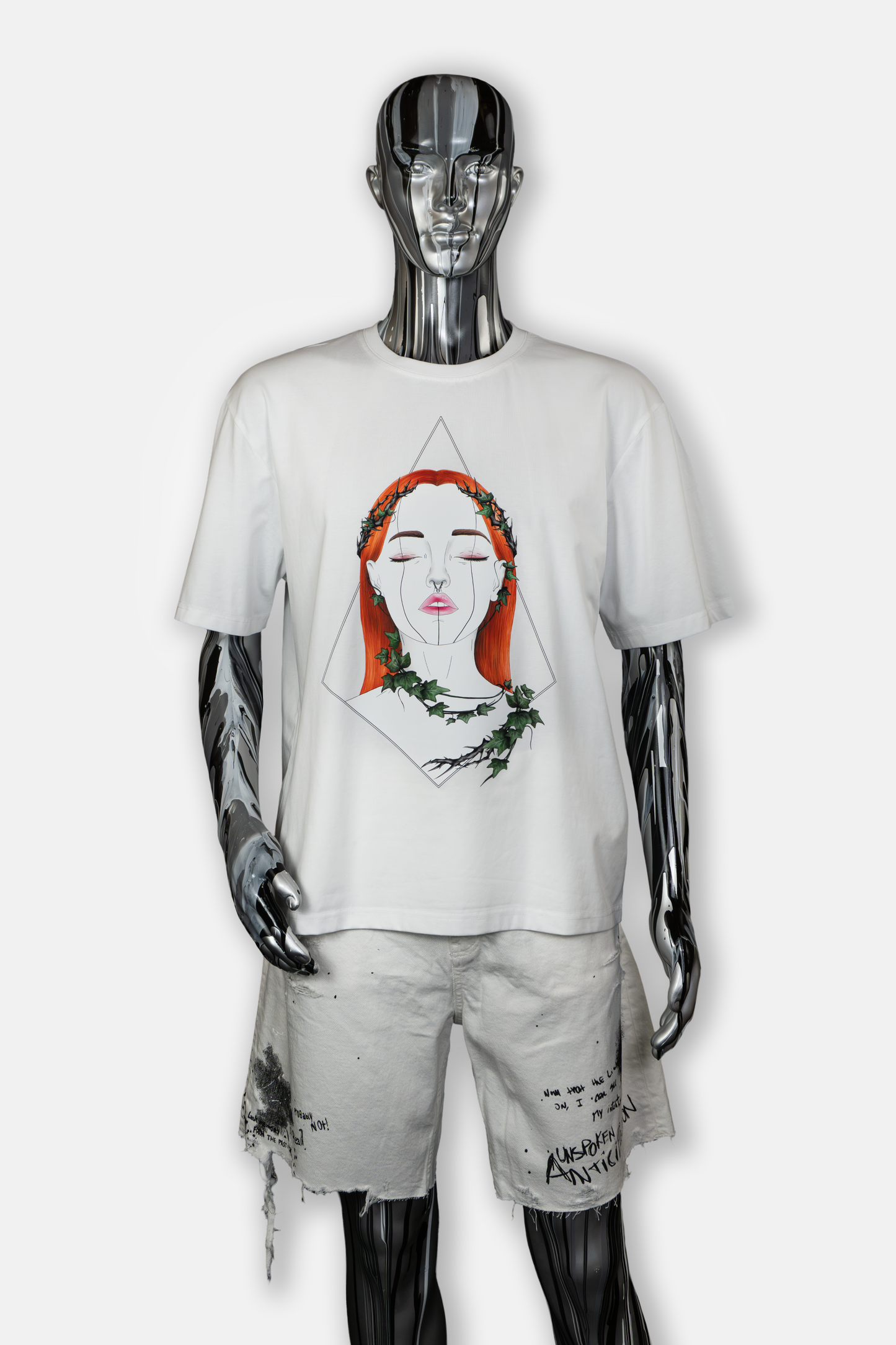 Male mannequin wearing Tangled Ivy men's white tee with hand-drawn nature-inspired ivy patterns
