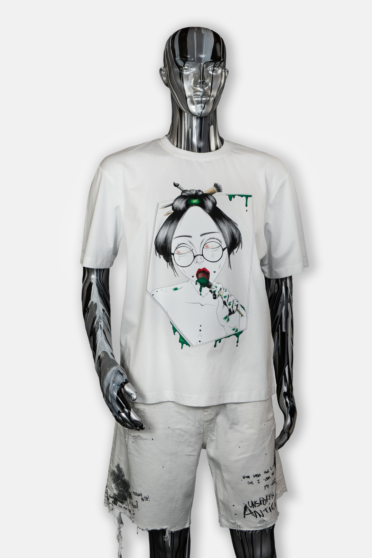 Male mannequin wearing Painted in Green men's white t-shirt with bold green hand-drawn brushstrokes