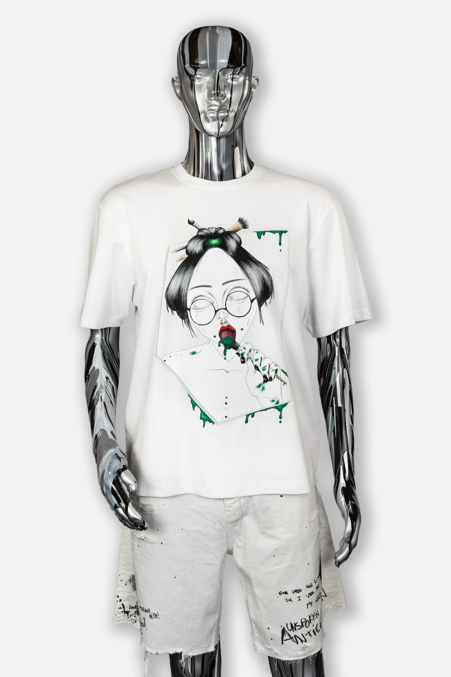 Male mannequin wearing Painted in Green Pierced Edition on white T-shirt