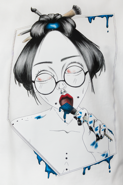 Close-up of Painted in Blue Pierced Edition on white T-shirt