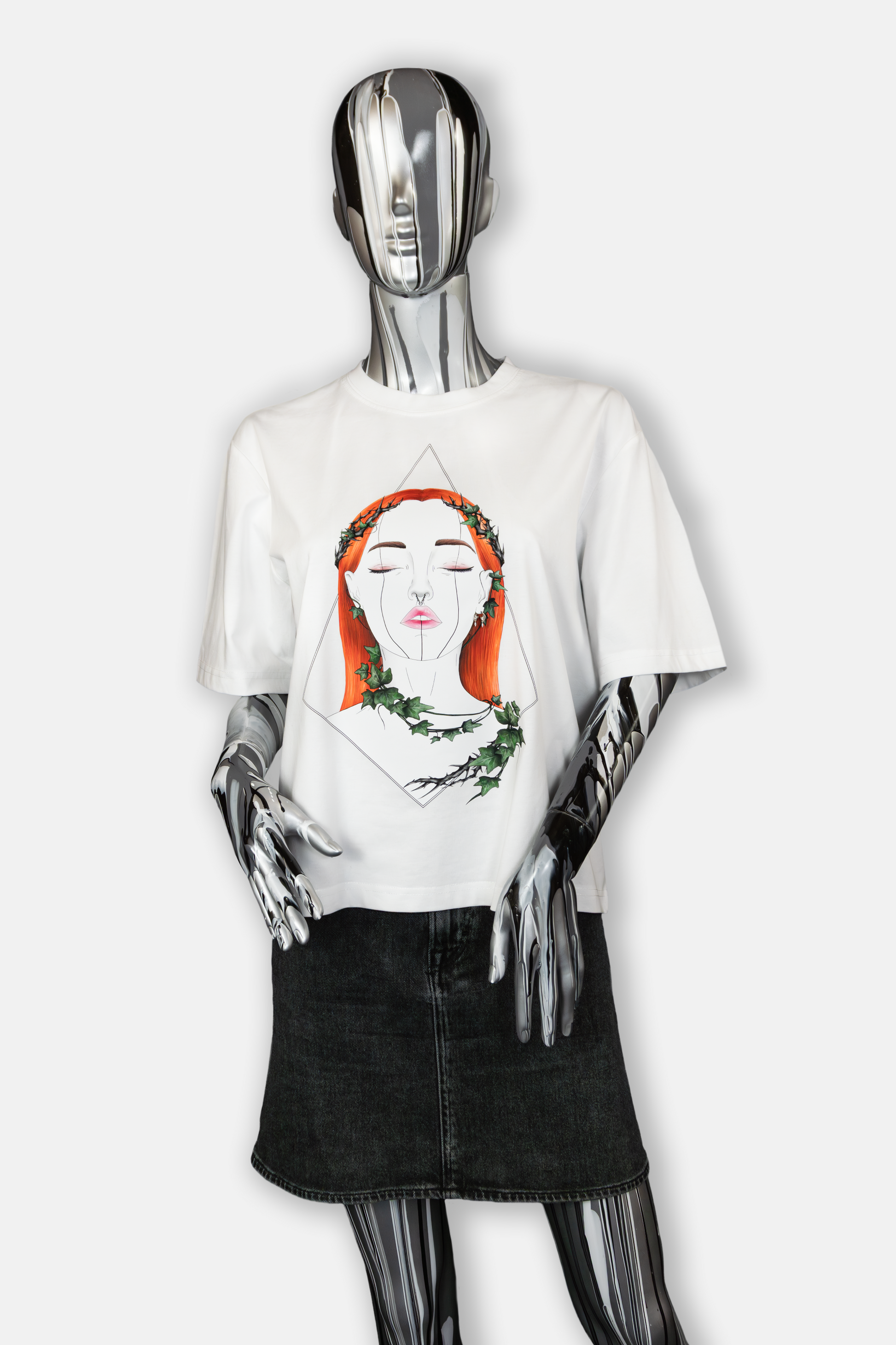 Female mannequin wearing Tangled Ivy Pierced Edition on white T-shirt