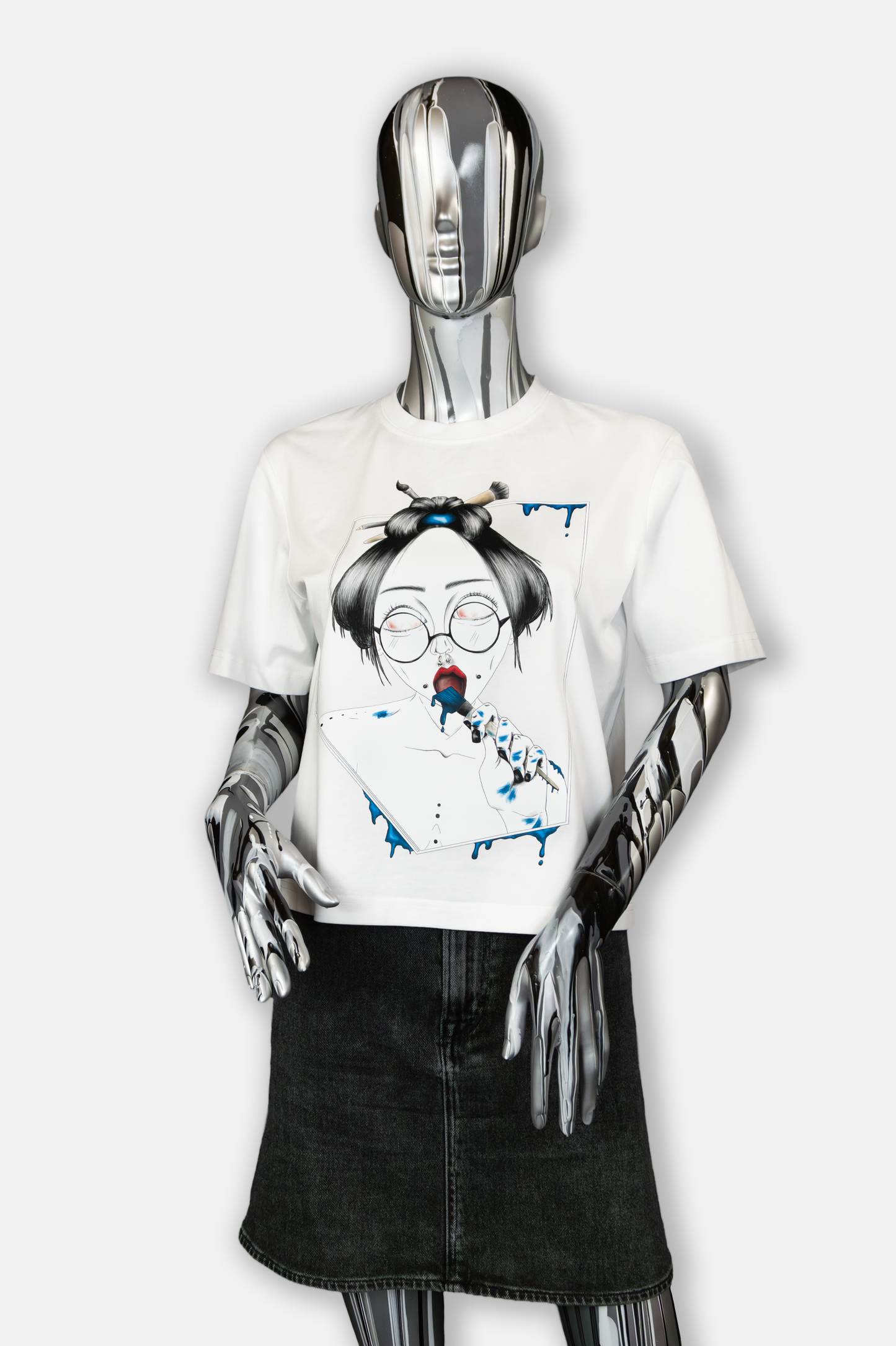 Female mannequin wearing Painted in Blue Pierced Edition on white T-shirt