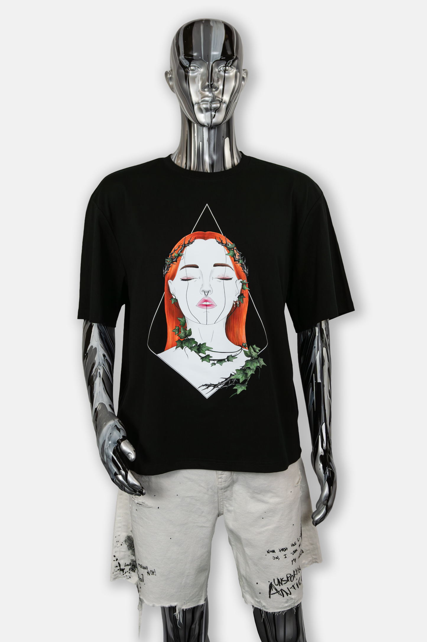 Male mannequin wearing Tangled Ivy Pierced Edition on black T-shirt