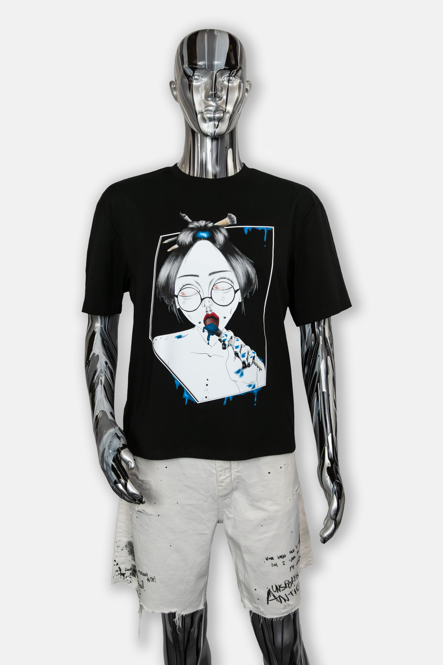 Male mannequin wearing Painted in Blue Pierced Edition on black T-shirt