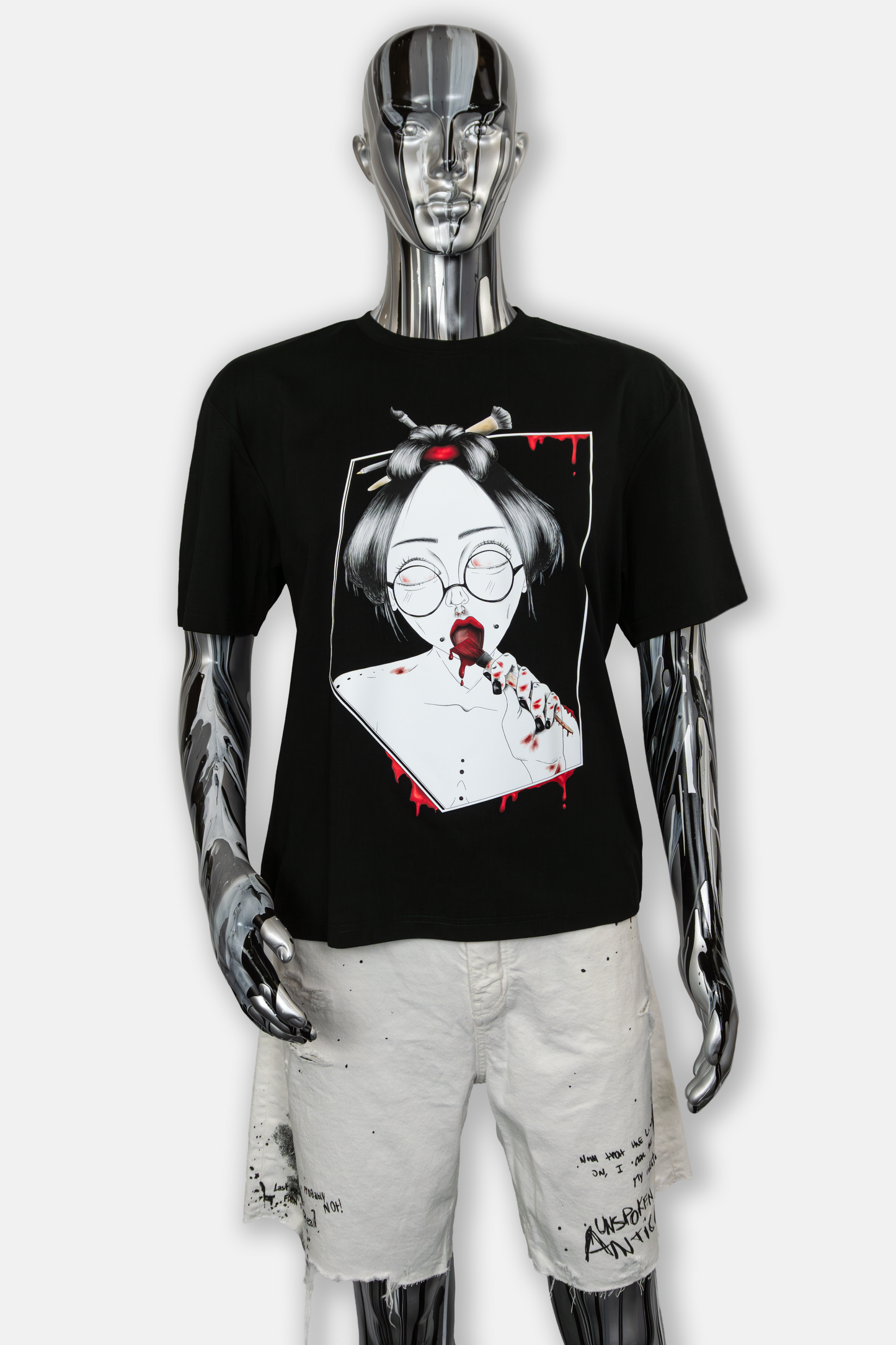 Male mannequin wearing Painted in Red Pierced Edition on black T-shirt