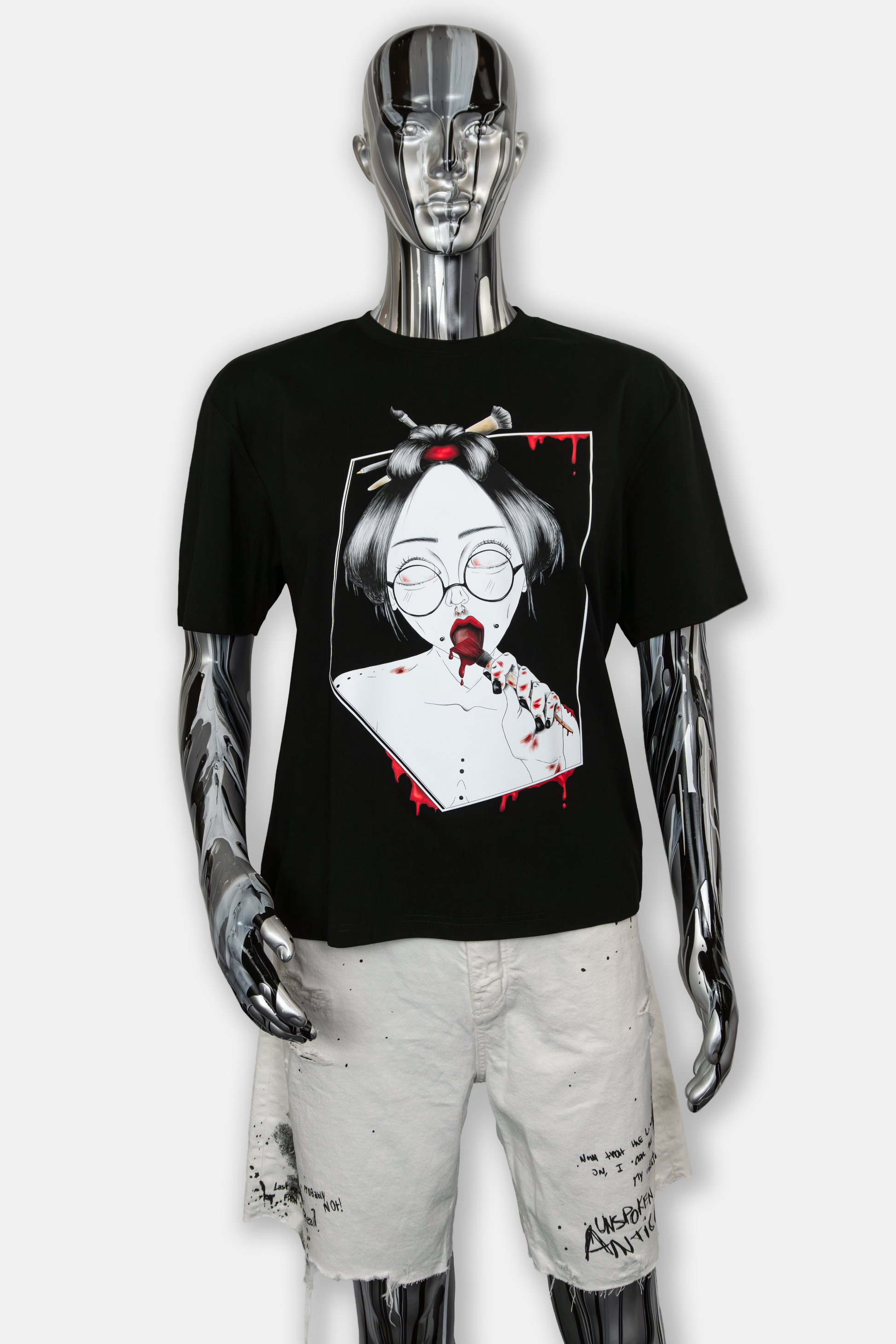 Male mannequin wearing Painted in Red Pierced Edition on black T-shirt