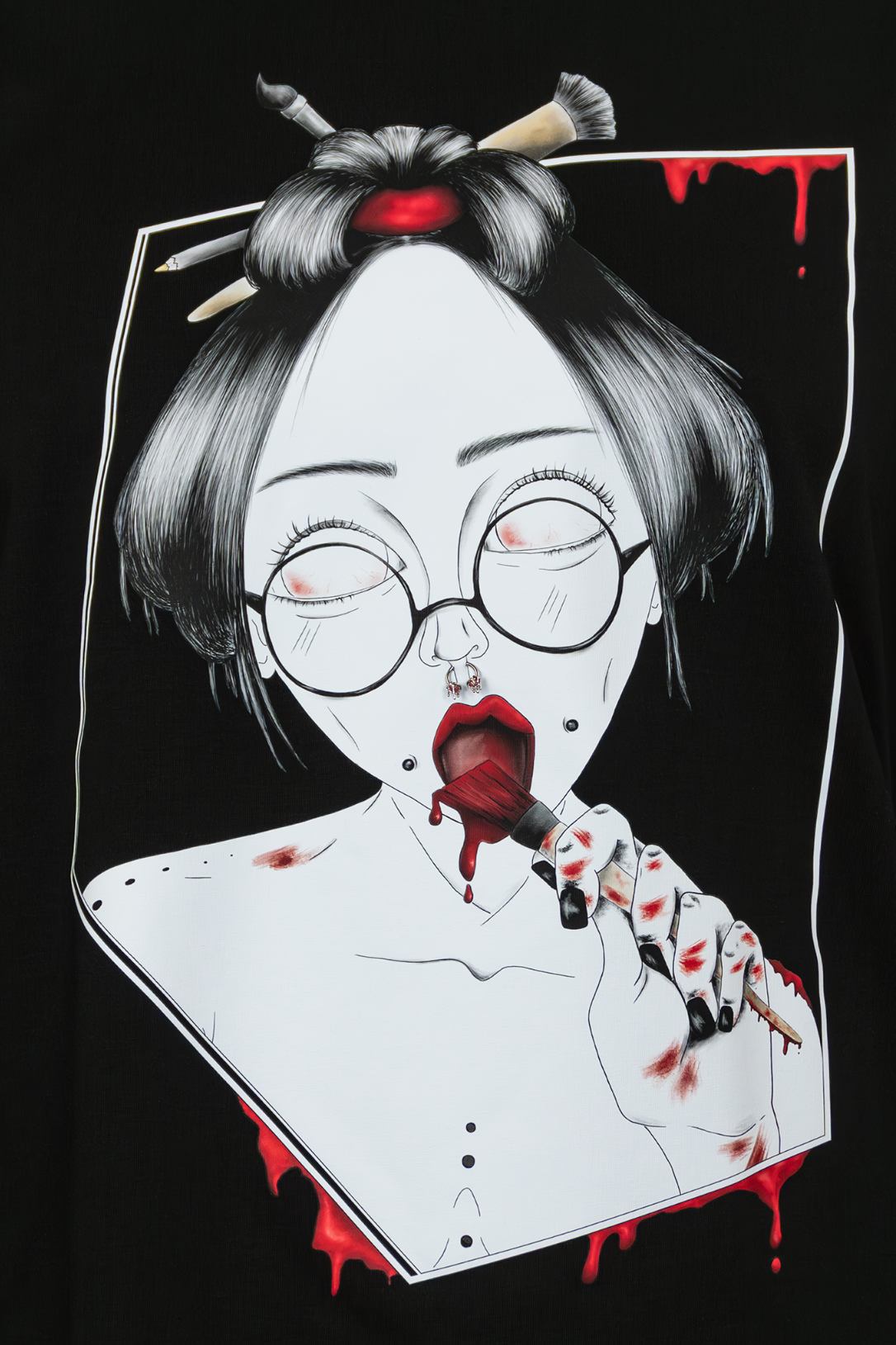 Close-up of Painted in Red Pierced Edition on black T-shirt