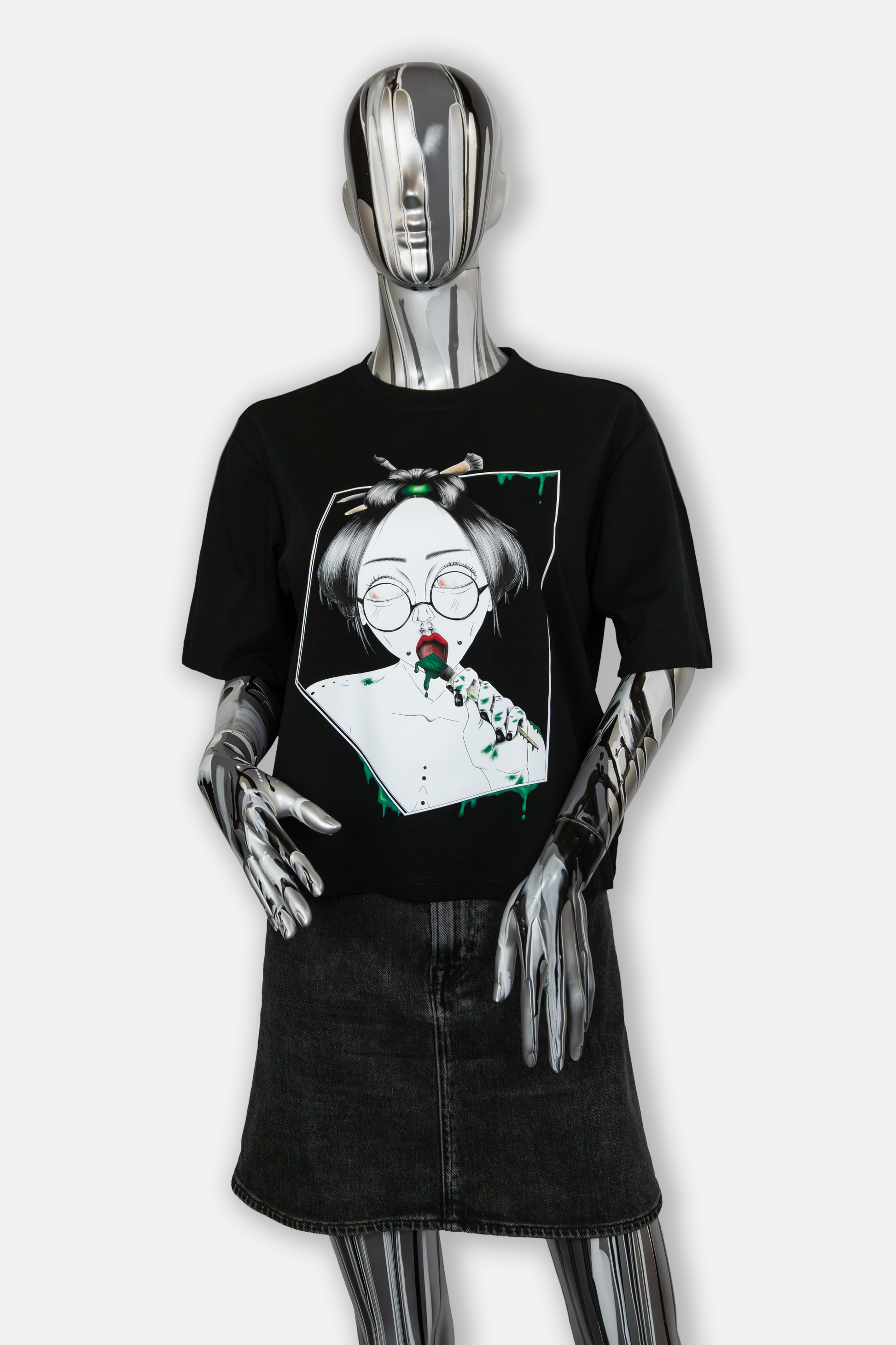 Female mannequin wearing Painted in Green Pierced Edition on black T-shirt