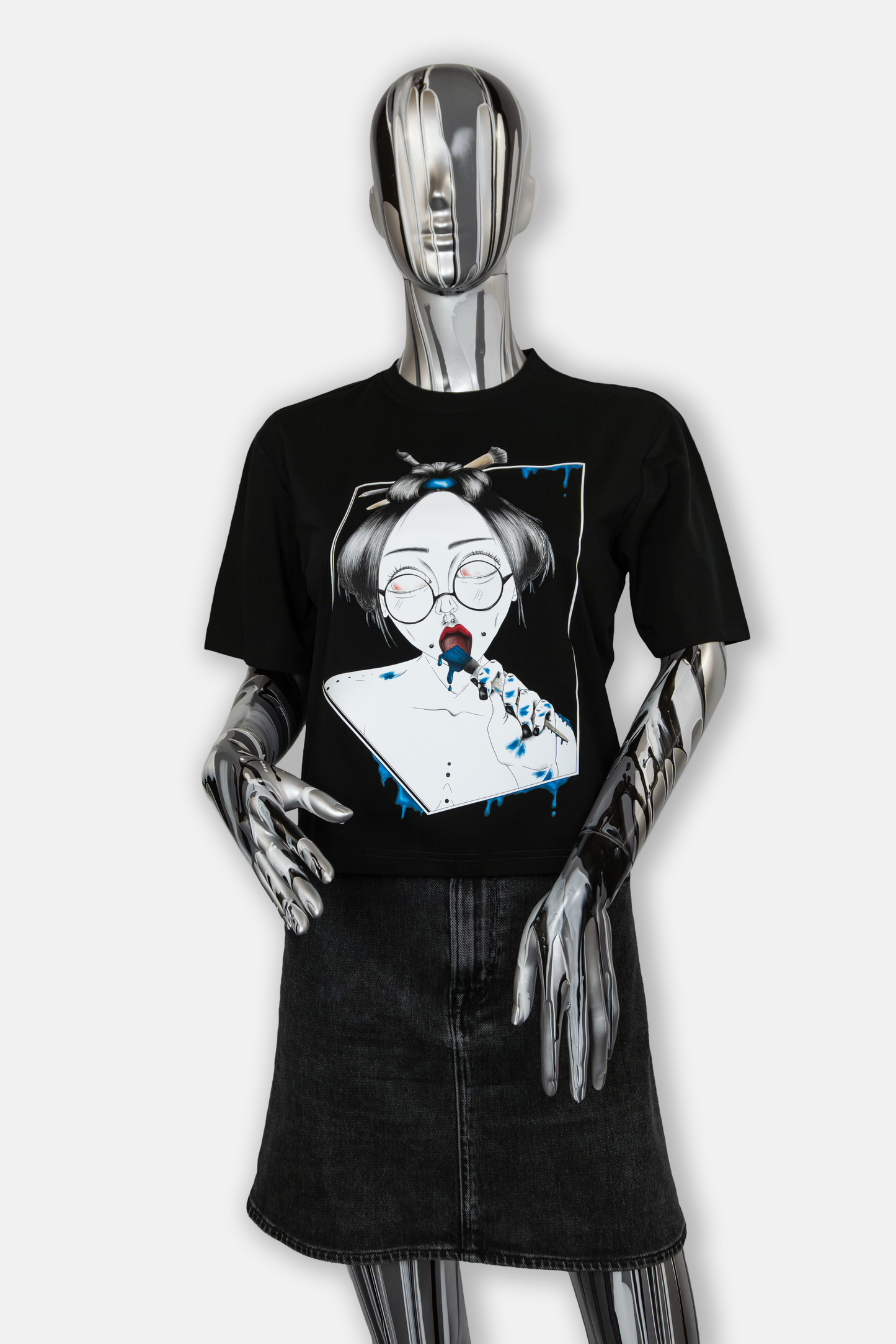 Female mannequin wearing Painted in Blue Pierced Edition on black T-shirt