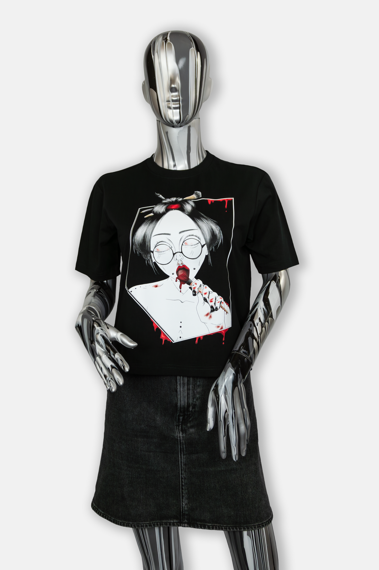 Female mannequin wearing Painted in Red Pierced Edition on black T-shirt