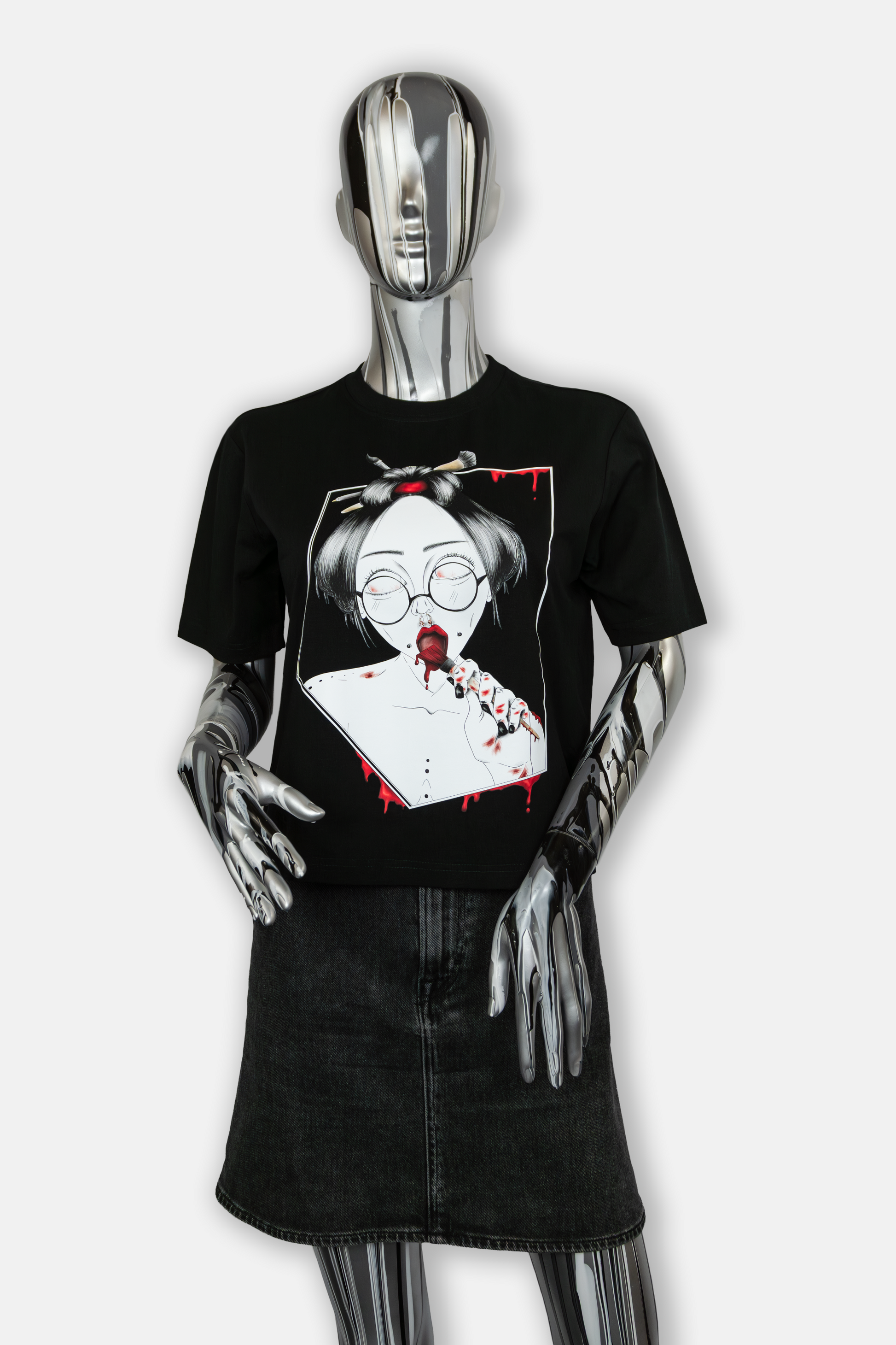 Female mannequin wearing Painted in Red Pierced Edition on black T-shirt