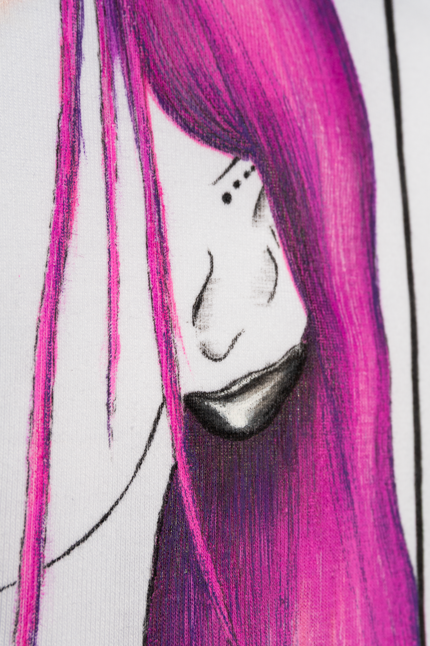 Close up of an earring and hair of the design Pair of Hearts, the girl with blue and pink hair. This is hand painted on a white tshirt.