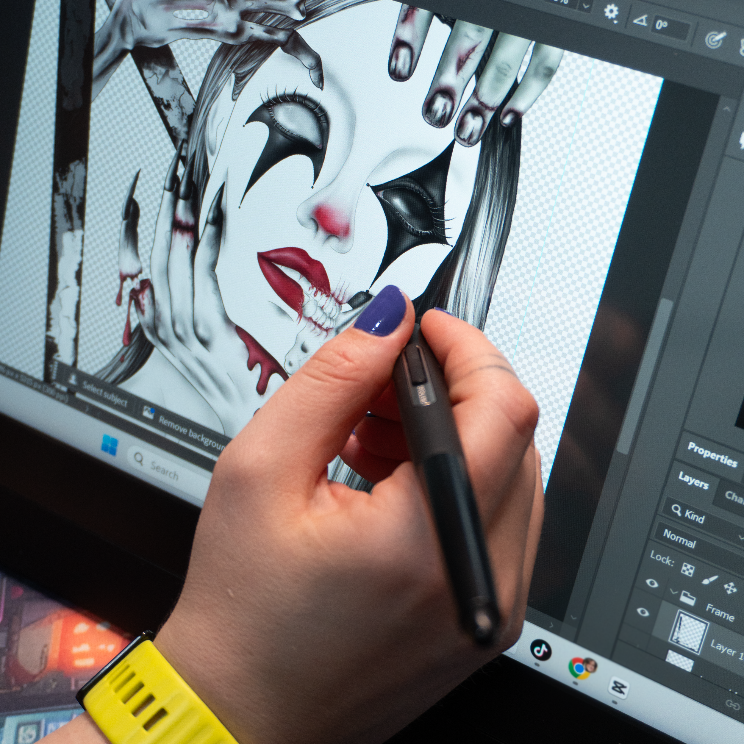 Hand using a stylus on a digital art software with a detailed illustration of a character on the screen.