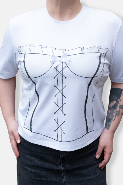 Black corset painted on a white tshirt with shimmery details and a sewed bow. Cotton tee for women.
